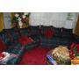 Sectional Sofa with Multi-Color Patterned Upholstery and Red Accent Pillows