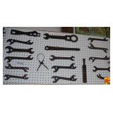 Assorted Metal Wrenches and Hand Tools on Pegboard Display
