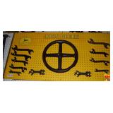 John Deere Display Board with Cast Iron Wheel and Assorted Wrenches