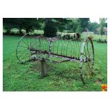 Horse-Drawn Dump Rake Farm Implement with Steel Wheels and Seat