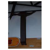 Cast Iron Implement Seat on Mounting Bracket Displayed on Wood Board