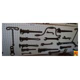 Collection of Assorted Hand Tools and Wrenches Displayed on Pegboard