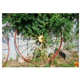 Metal Implement Wheel with Red Rim and Yellow Spokes