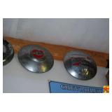 Two Chevrolet Hubcaps with Red Accent and Script Emblems