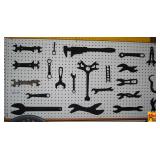 Assorted Collectible Wrenches and Hand Tools on Pegboard Display