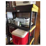 Black and Yellow Storage Shelving Unit With Assorted Garage Contents
