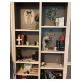 Bookshelf With Religious Decor and Literature