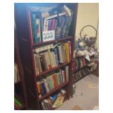 Assorted Book Collection on Wooden Bookshelf