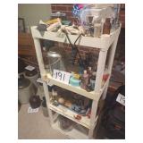 Four-Tier Plastic Utility Shelf with Assorted Household Goods