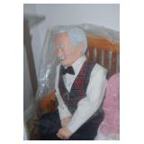 Elderly Couple Figurines Seated on Wooden Bench