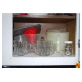 Assorted Kitchen Cabinet Lot featuring Glassware, Storage Containers, and Drinkware