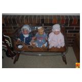 Three Porcelain Baby Dolls in Wooden Rocking Cradle with Painted Heart Cutouts