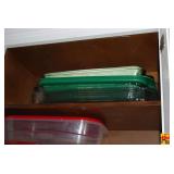 Kitchen Cabinet Assortment of Bakeware, Storage Containers, and Pitcher