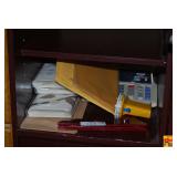 Office Desk Compartment Contents Including Calculator, Metal Boxes, and Dusters
