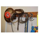 Shop Assortment with Corner Clamp, Cordage, Wire, and Hardware on Wooden Wall Rack