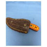 Custom Curved Blade Knife with Orange and Yellow Patterned Wood Handle and Brown Leather Sheath