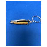 Miniature Folding Pocket Knife Keychain with Yellow Handle Scales