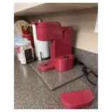 Red Single-Serve Coffee Maker and Kitchen Countertop Accessories