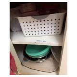 Kitchen Cabinet Contents Including Linens, Utensils, and Storage Containers