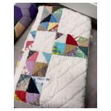 Handmade Patchwork Quilt with White Background and Multicolored Fabric Blocks