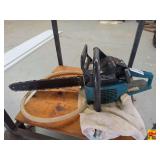 Teal and Black Gas Powered Chainsaw with Guide Bar and Chain