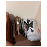 Collection of Vinyl Records in Wooden Rack