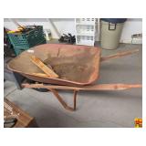 Red Metal Wheelbarrow with Wooden Handles and Pneumatic Tire