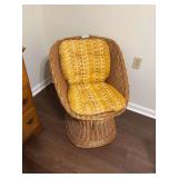 Wicker Swivel Chair with Yellow Patterned Cushion