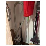 Assorted Closet Cleanout Lot Including Shark Vacuum and Storage Boxes