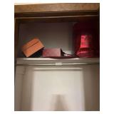 Closet Contents Lot with Storage Totes, Small Accent Table, Gift Wrap, and Miscellaneous Items
