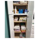 White Bathroom Storage Cabinet with Linens and Personal Care Items