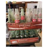 Two Wooden Coca-Cola Crates with Assorted Glass Soda Bottles