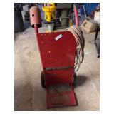 Red Metal Cylinder Cart with Hose and Torch