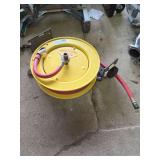 Retractable Yellow Hose Reel with Red Hose