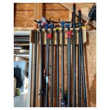 Collection of Pipe Clamps in Wall Rack