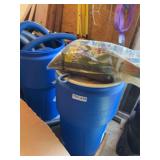Blue Plastic Barrels with Corrugated Hoses and Substrate