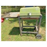 cast aluminum charcoal grill on cart