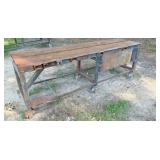 rolling table 91x25x34H, 6 metal casters, top is