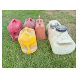 4) 5 gal fuel cans, !0 14 gal sprayer tank