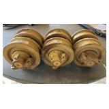 3) bottom rollers off 650G John Deere dozer