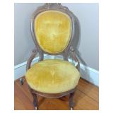 antique yellow velvet covered vanity chair on whee
