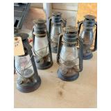 5 black kerosene lanterns