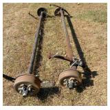 2  axles(1 bent ) w sprngs, 4 rims/hubs on 4.5 pat