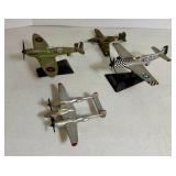 Four Small Metal Planes - Some on Stands