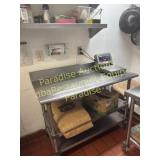 Stainless table with backsplash and casters