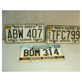 Three NORTH DAKOTA License Plates