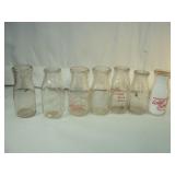 Seven Small Dairy Bottles