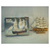 Ship Model and a Ship with a Broken Mast Stick