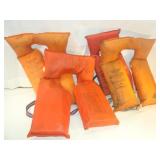 Four Orange Life Jackets
