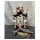 Antique cuckoo clock with pendulum and two